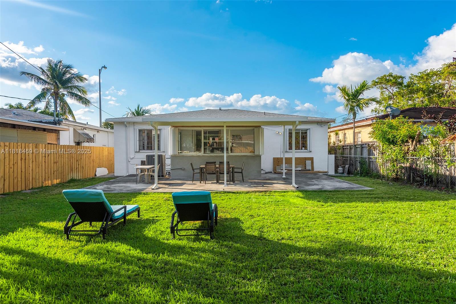 1545 Normandy Drive Miami Beach, FL 33141 - Photo 33 of 37 a view of a house with backyard porch and sitting area
