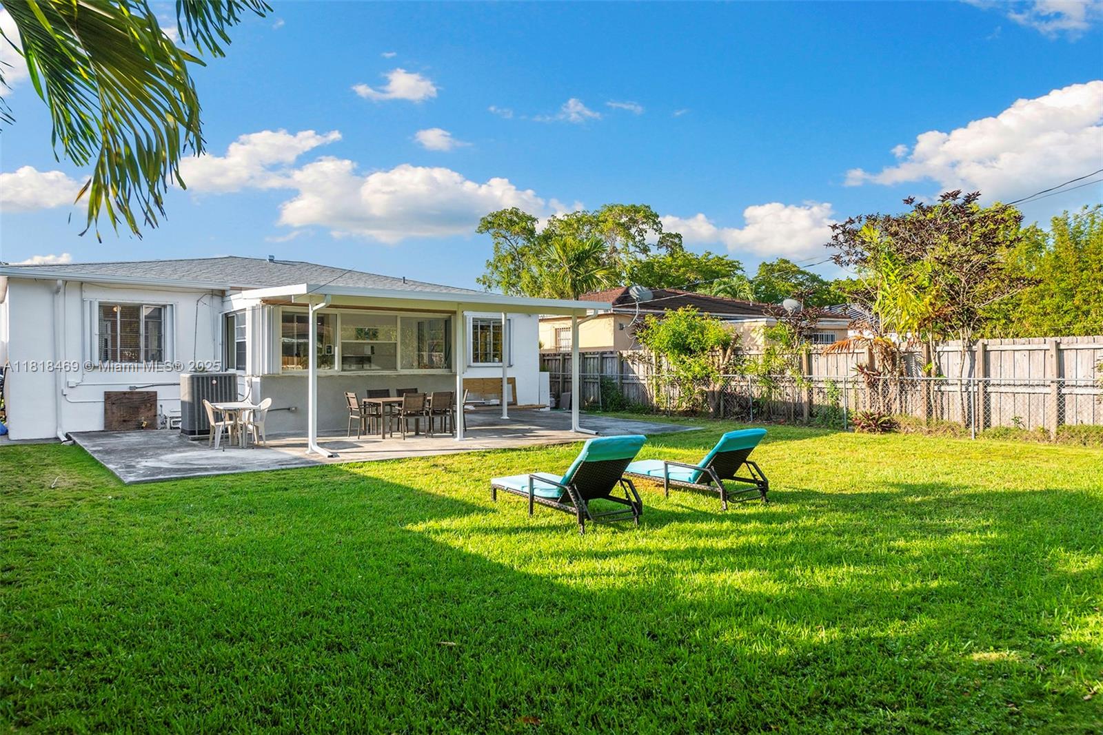 1545 Normandy Drive Miami Beach, FL 33141 - Photo 35 of 37 a view of a house with a yard patio and swimming pool