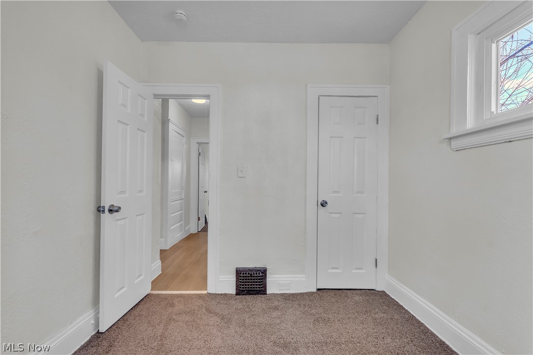 12905 Watterson Avenue Cleveland, OH 44105 - Photo 12 of 30 Unfurnished bedroom featuring baseboards and light carpet