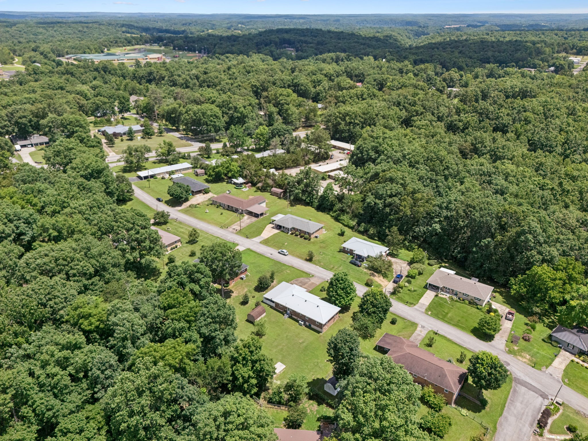 708 Hickory Street Centerville, TN 37033 - Photo 46 of 57 an aerial view of residential houses with outdoor space