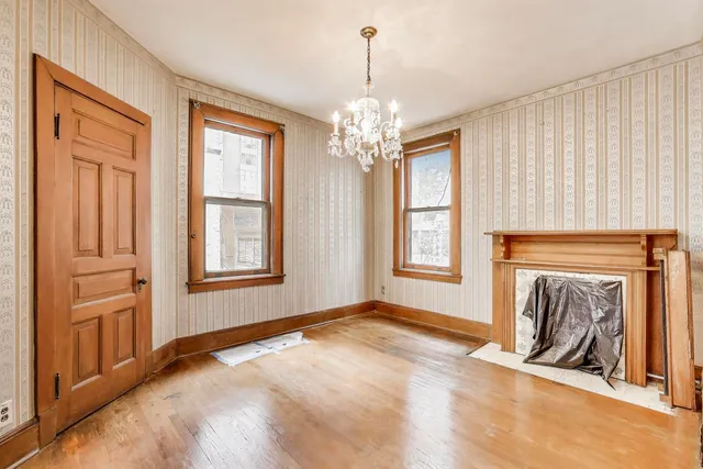 a view of a chandelier in a room with a window
