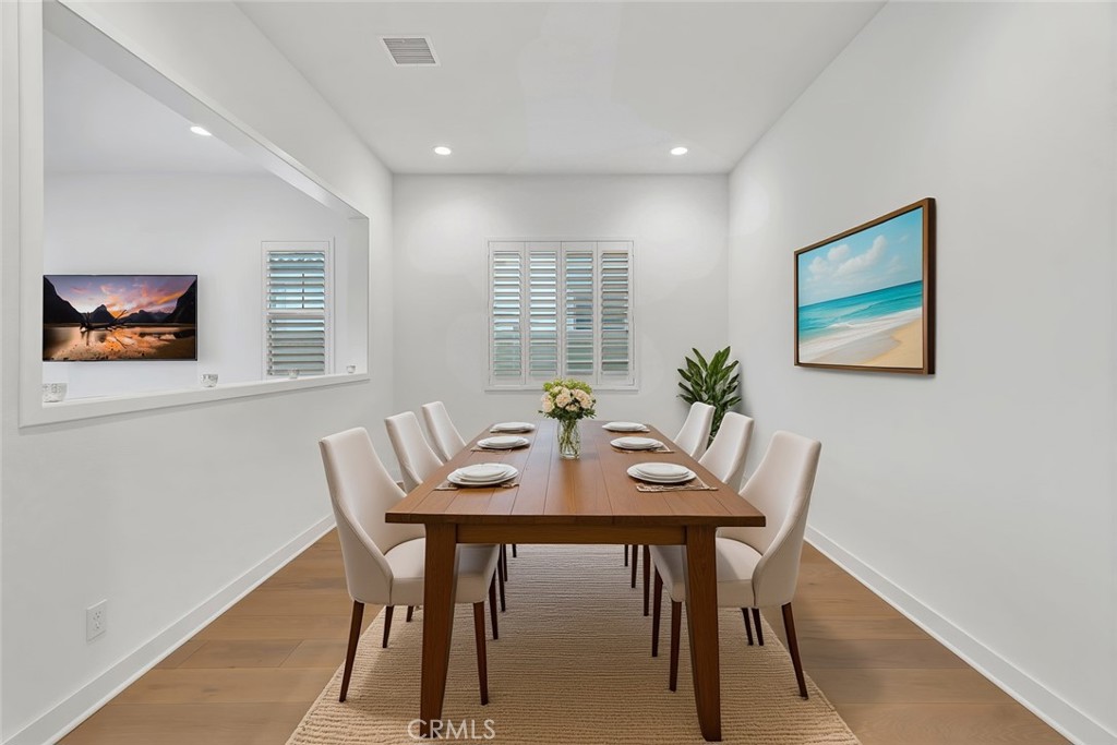 14432 Windfall Lane Huntington Beach, CA 92647 - Photo 20 of 62 a view of a dining room with furniture window and wooden floor