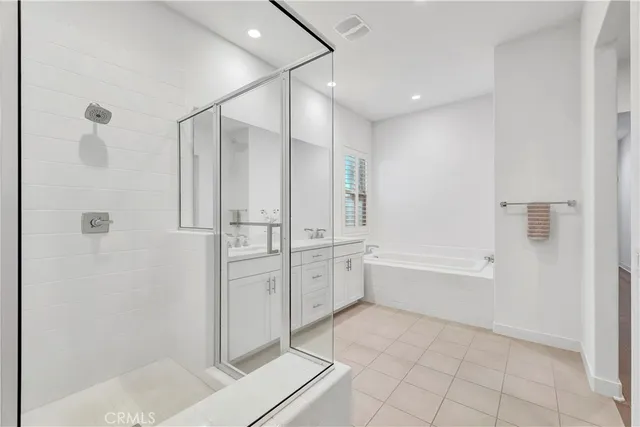 a view of an empty room with wooden floor and closet