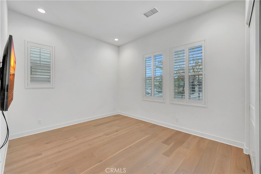 14432 Windfall Lane Huntington Beach, CA 92647 - Photo 38 of 62 an empty room with windows