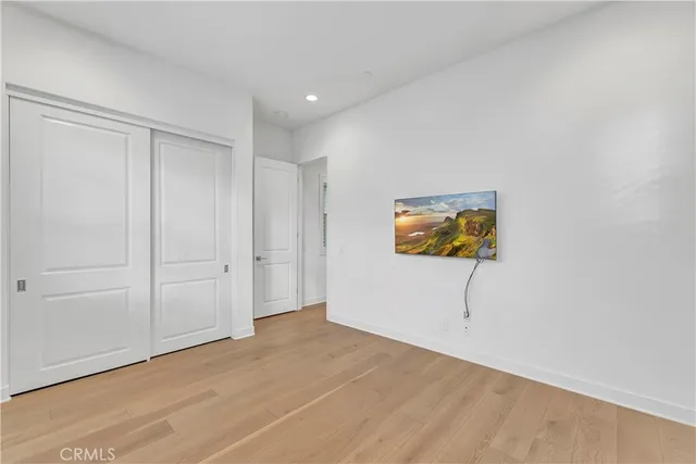 a view of a house with potted plants in front of door
