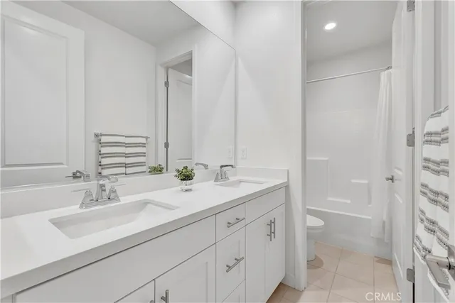 a view of a house with a yard and potted plants