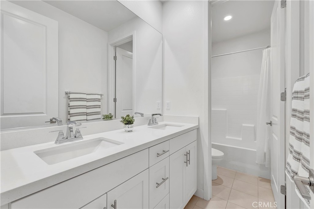 14432 Windfall Lane Huntington Beach, CA 92647 - Photo 40 of 62 a bathroom with a sink and a mirror