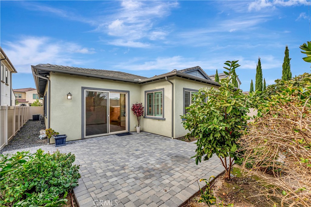 14432 Windfall Lane Huntington Beach, CA 92647 - Photo 50 of 62 a view of a house with potted plants in front of door
