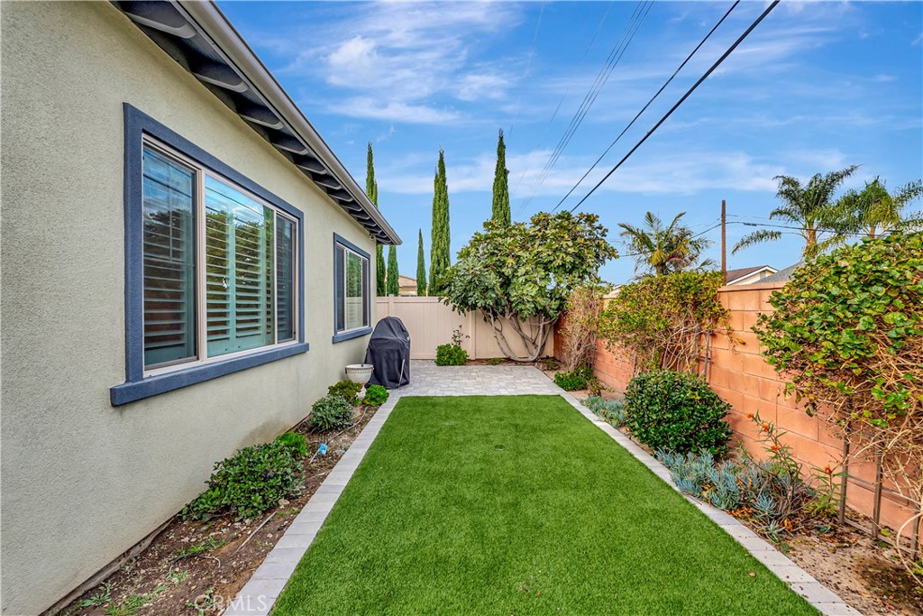 14432 Windfall Lane Huntington Beach, CA 92647 - Photo 52 of 62 a front view of a house with a yard