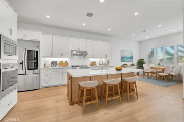a view of kitchen with wooden floor