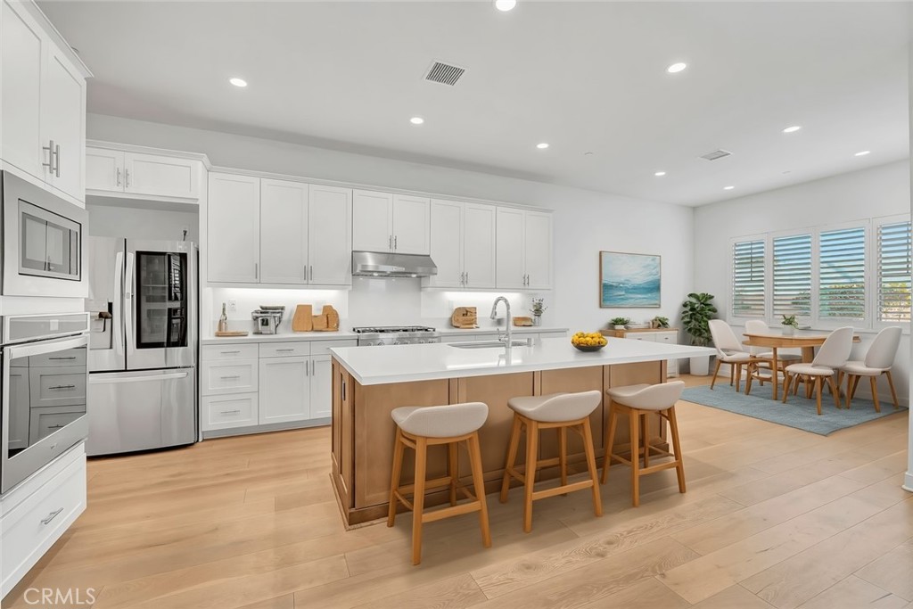 14432 Windfall Lane Huntington Beach, CA 92647 - Photo 7 of 62 Kitchen and Dining Room Virtually Staged