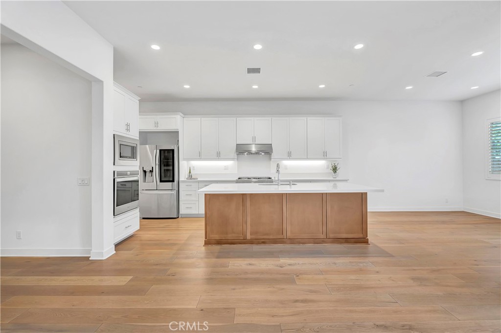 14432 Windfall Lane Huntington Beach, CA 92647 - Photo 8 of 62 a view of kitchen with wooden floor