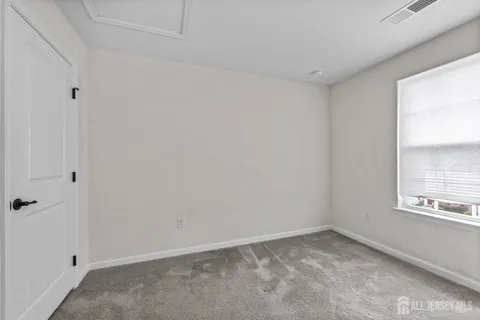 a view of an empty room and a window