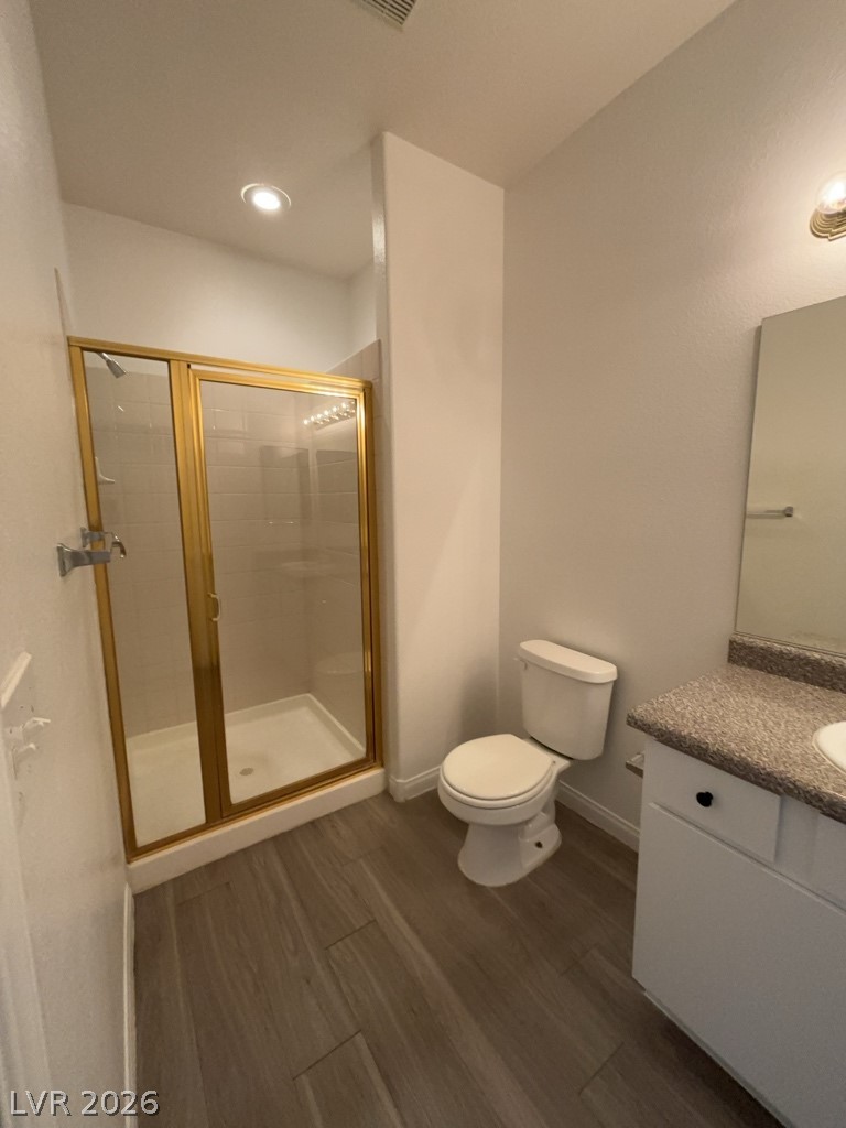 4915 East Russell Road, Unit 160 Las Vegas, NV 89120 - Photo 11 of 12 Bathroom featuring vanity, a stall shower, and dark wood-style floors