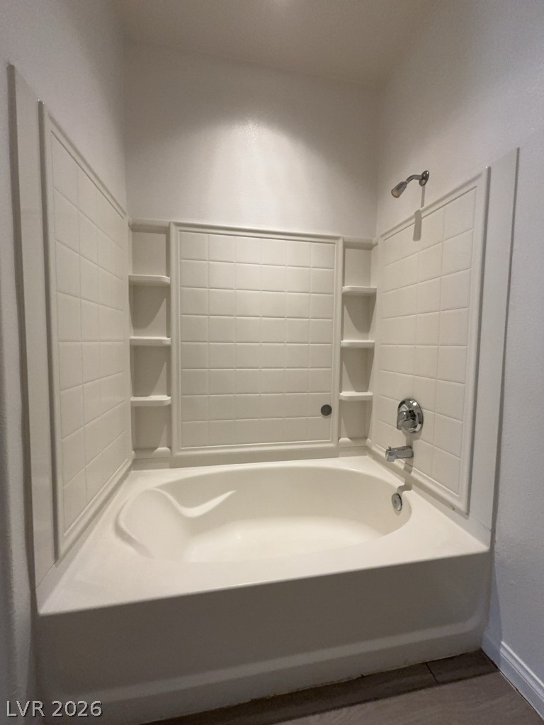 4915 East Russell Road, Unit 160 Las Vegas, NV 89120 - Photo 10 of 12 Bathroom featuring shower / bathtub combination and baseboards