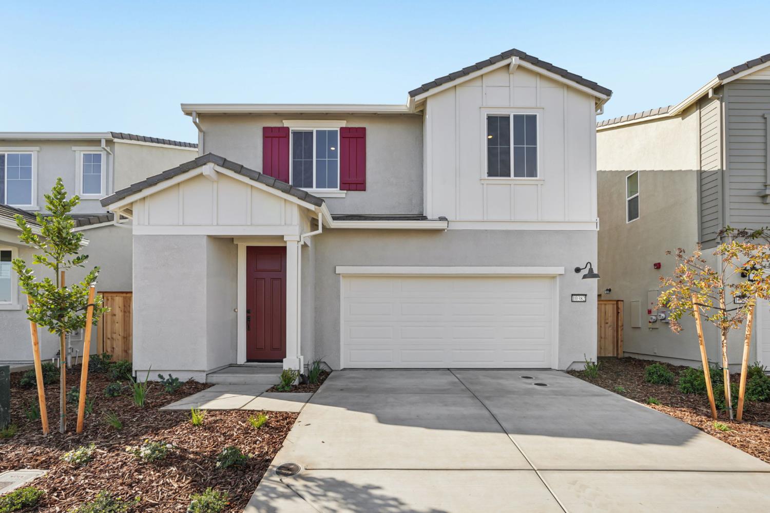 10382 Mornington Way Elk Grove, CA 95757 - Photo 1 of 1 a front view of a house with a yard and garage