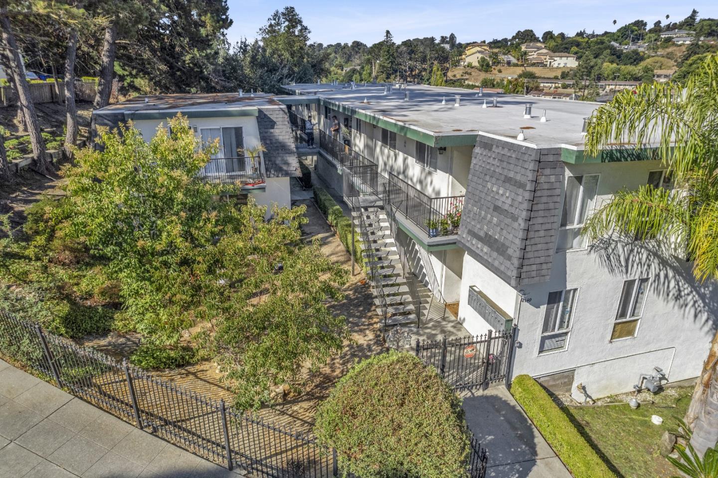 a view of a large building with a yard