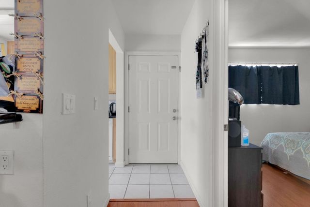 a view of balcony with wooden floor and fence