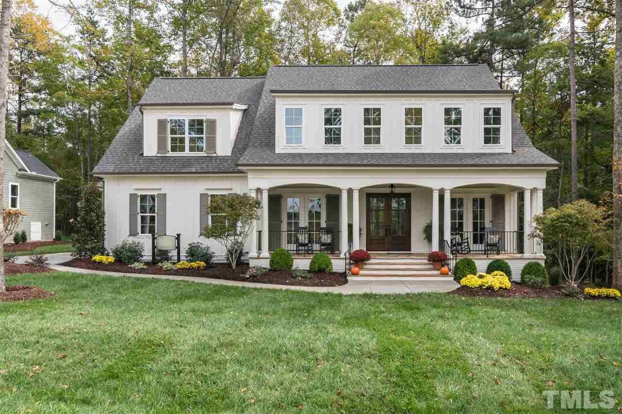 6908 Ray Family Farm Court, Unit 8 Raleigh, NC 27613 - Photo 1 of 3 front view of a house with a yard