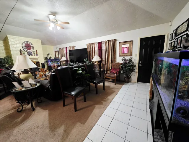 a view of a livingroom with furniture and a flat screen tv