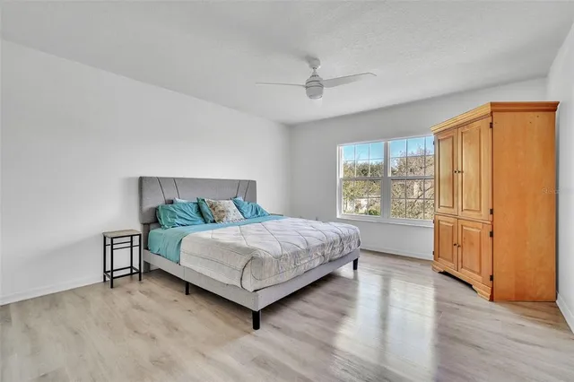 a bedroom with a bed and window