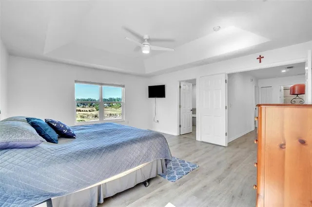 a bedroom with a large bed and a window