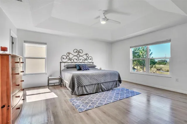 a bedroom with a large bed and a window