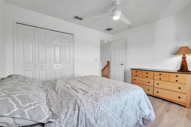 a bedroom with a bed and a dresser