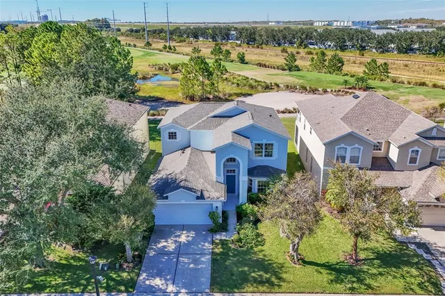 an aerial view of a house with a garden
