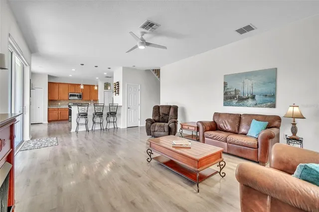 a living room with furniture and a table