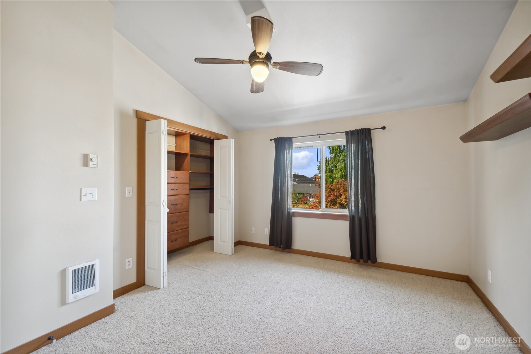9228 15th Avenue Southwest, Unit B Seattle, WA 98106 - Photo 12 of 16 a view of a livingroom with a ceiling fan and window