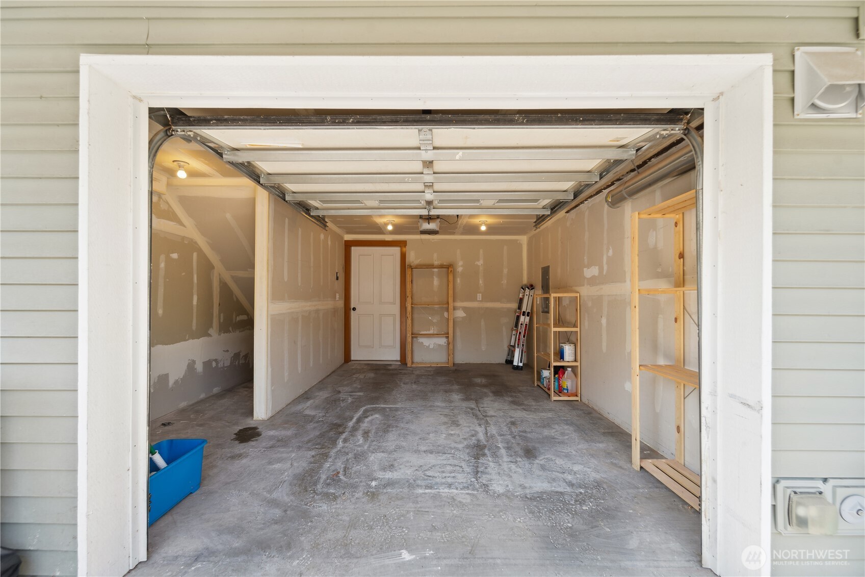 9228 15th Avenue Southwest, Unit B Seattle, WA 98106 - Photo 15 of 16 a view of a hallway with wooden shelves
