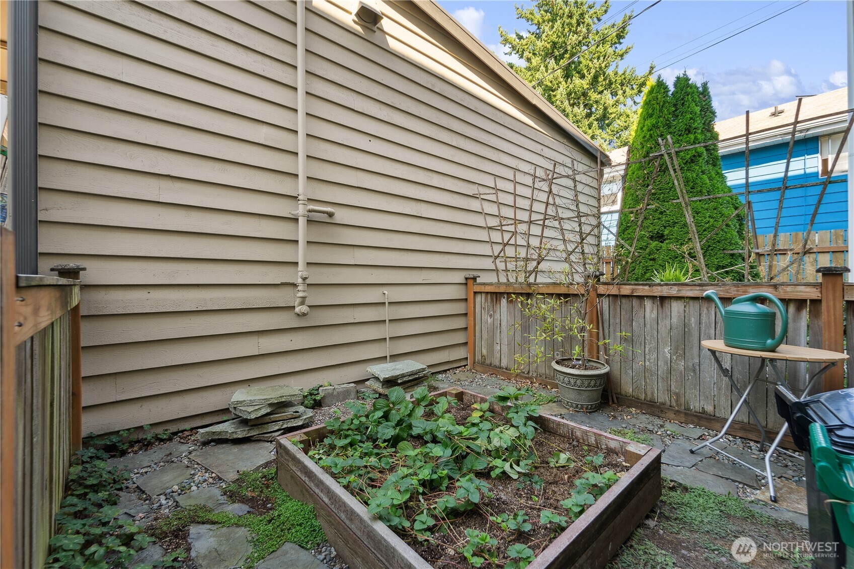 9228 15th Avenue Southwest, Unit B Seattle, WA 98106 - Photo 16 of 16 a view of a chairs and table in backyard