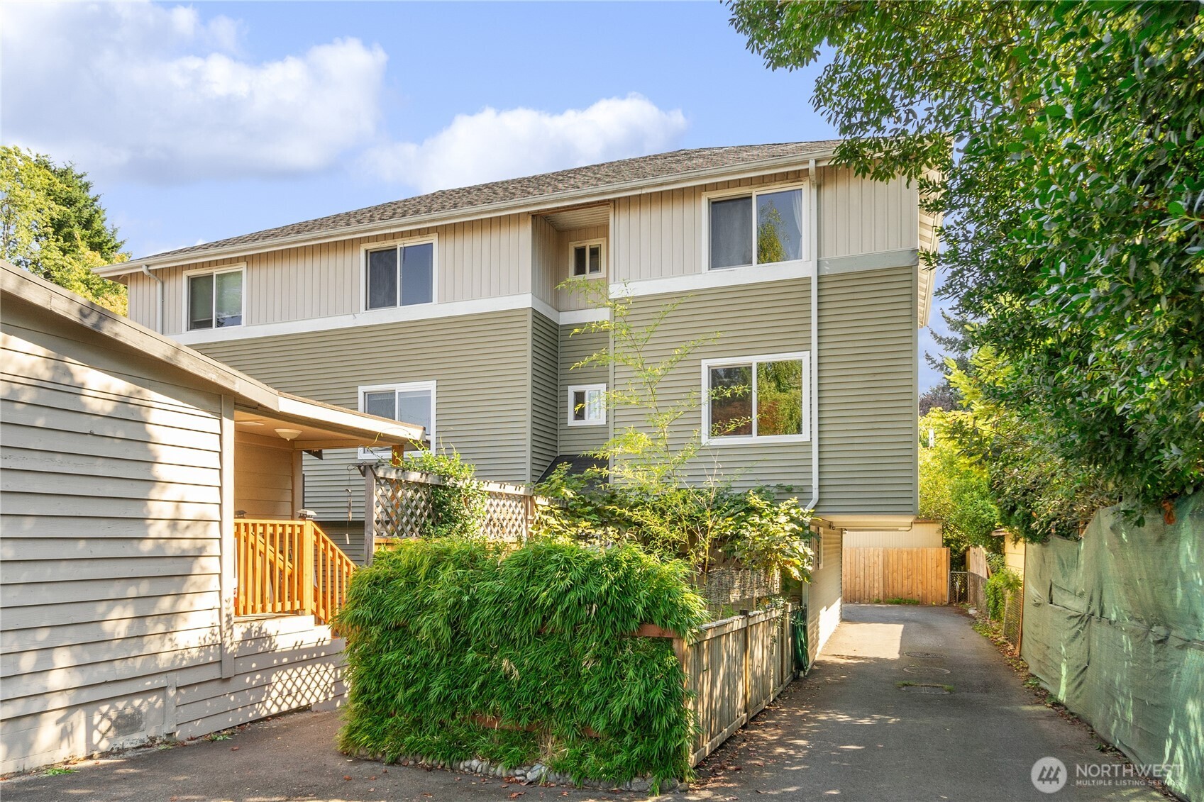 9228 15th Avenue Southwest, Unit B Seattle, WA 98106 - Photo 2 of 16 a front view of a house with a yard