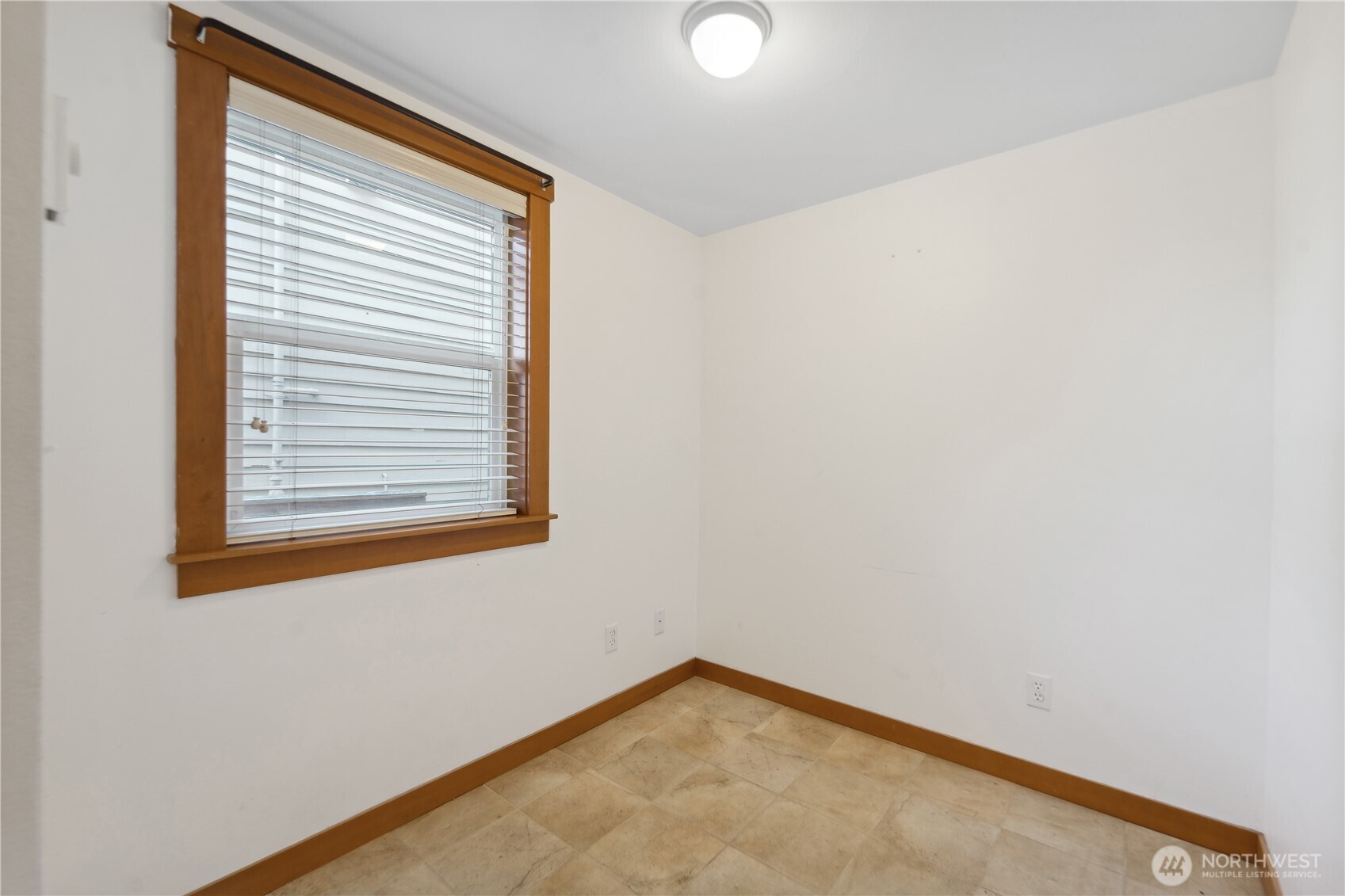 9228 15th Avenue Southwest, Unit B Seattle, WA 98106 - Photo 3 of 16 an empty room with a window