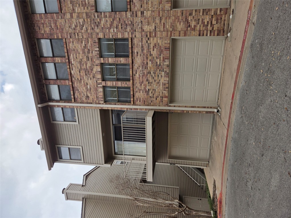 a front view of a house with garage