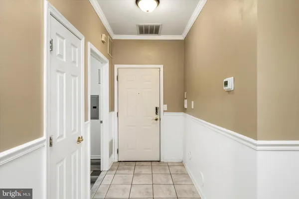 a view of a hallway with a white walls