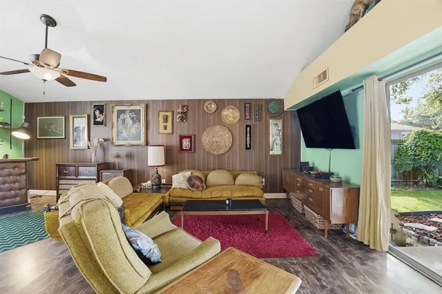 a living room with furniture fireplace and a flat screen tv