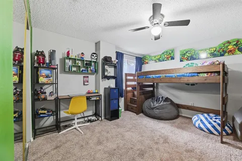 a room with furniture and a flat screen tv