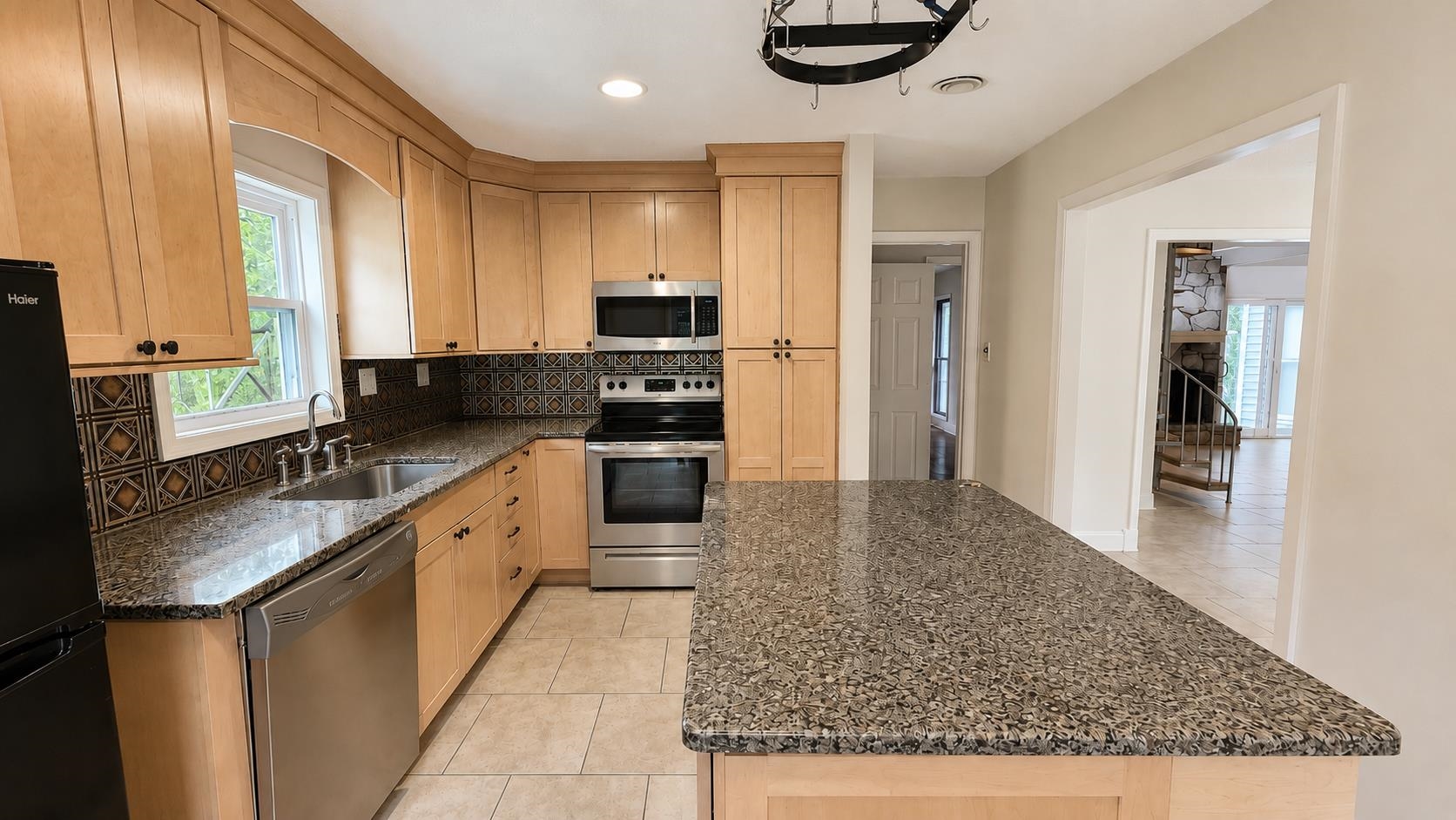 89 Ericson Road Memphis, TN 38018 - Photo 12 of 36 a kitchen with stainless steel appliances granite countertop a sink stove and refrigerator