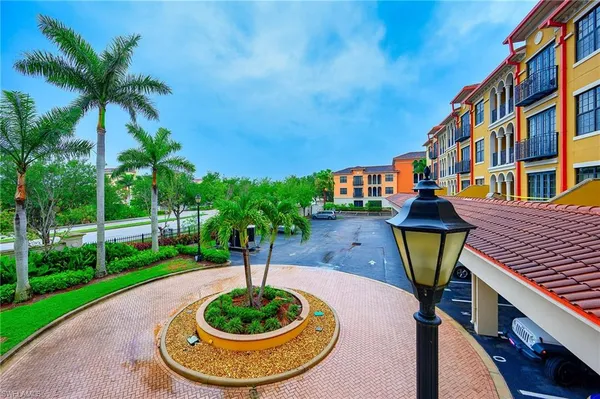 a swimming pool with a yard and plants