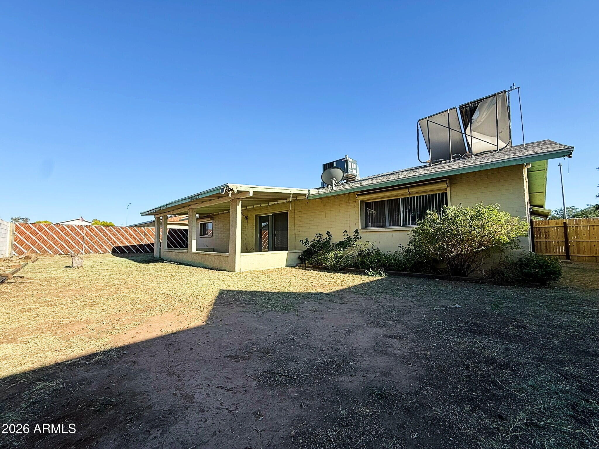 5208 West Calavar Road Glendale, AZ 85306 - Photo 25 of 39 a front view of a house with a yard