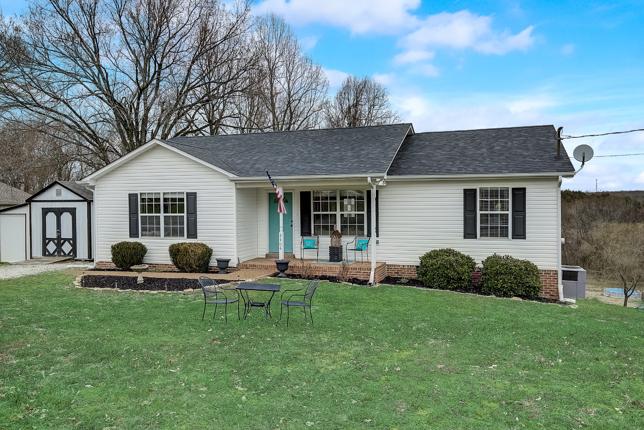 2404 Spring Ln Spring Hill Spring Hill, TN 37174 - Photo 2 of 26 a front view of house with a garden and patio