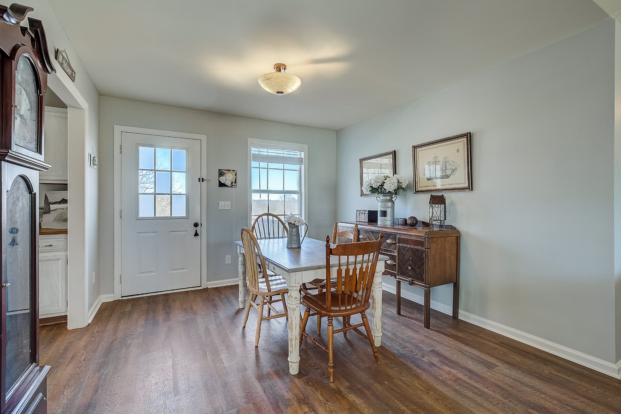 2404 Spring Ln Spring Hill Spring Hill, TN 37174 - Photo 8 of 26 a view of a dining room with furniture window and wooden floor