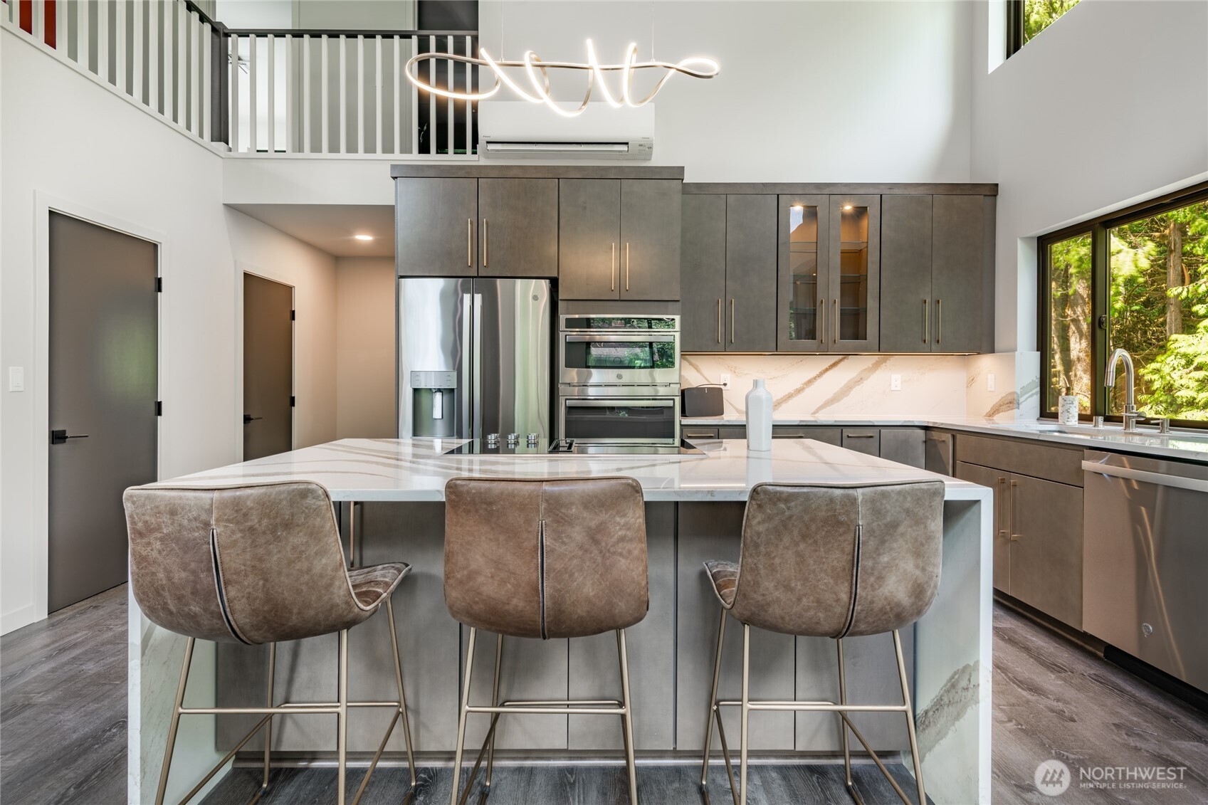 12031 Shuksan Rim Drive Deming, WA 98244 - Photo 11 of 39 a dining room with furniture a window and kitchen view