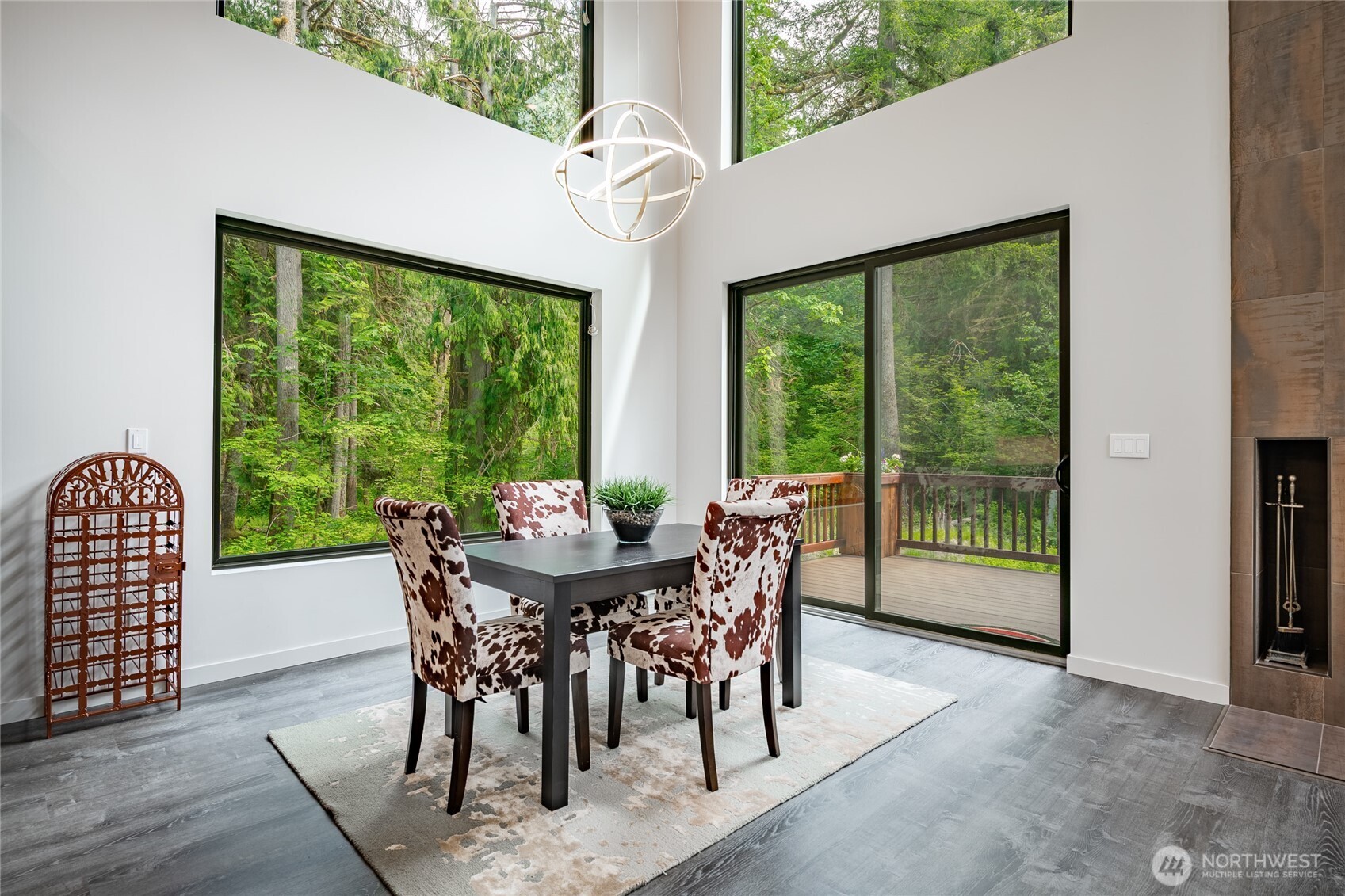 12031 Shuksan Rim Drive Deming, WA 98244 - Photo 13 of 39 a view of a dining room with furniture window and outside view