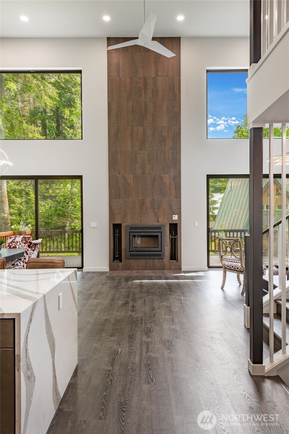 12031 Shuksan Rim Drive Deming, WA 98244 - Photo 14 of 39 a view of an empty room with a window and wooden floor