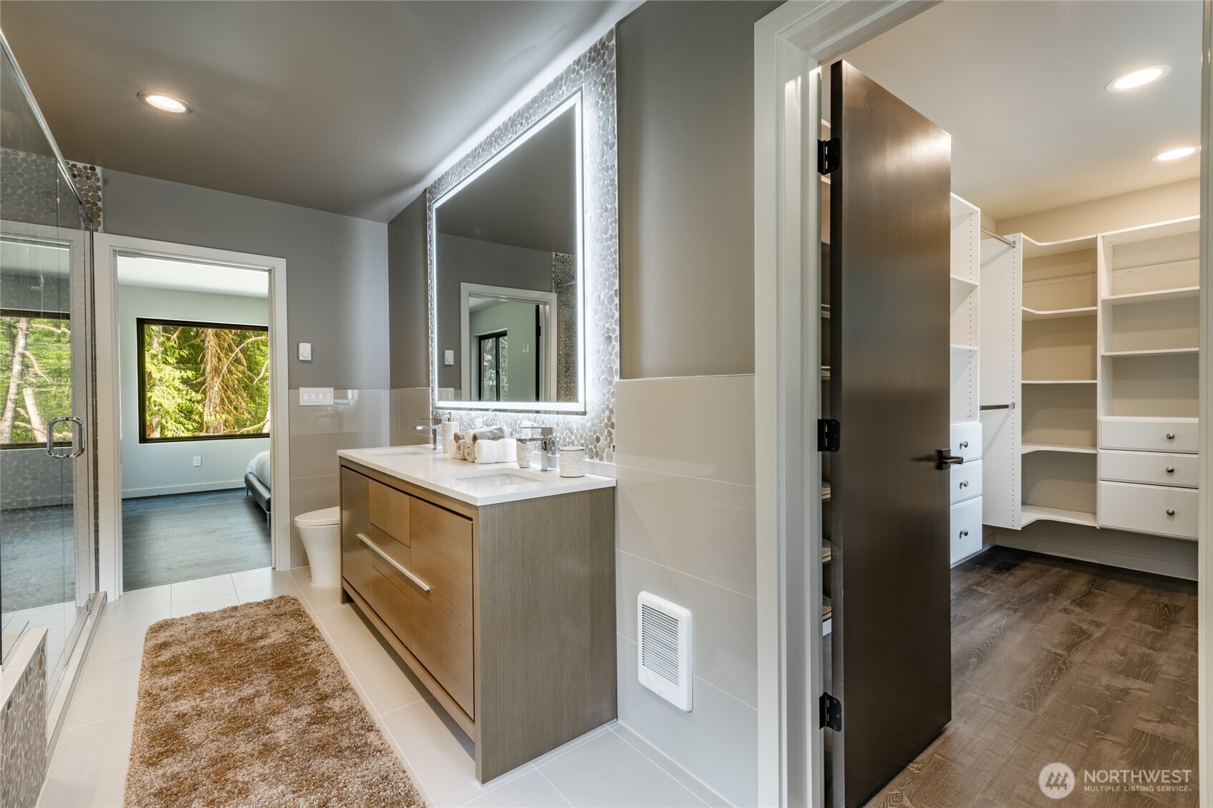 12031 Shuksan Rim Drive Deming, WA 98244 - Photo 25 of 39 a bathroom with a sink a mirror and a shower