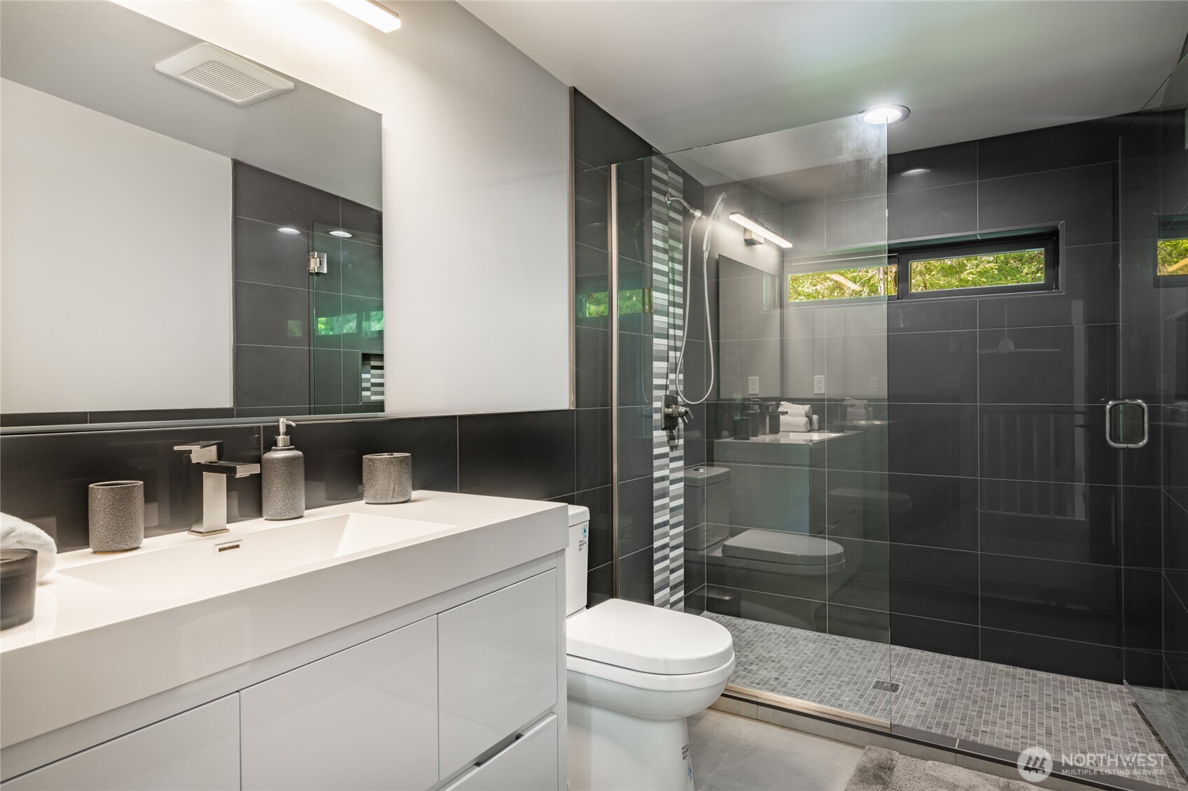 12031 Shuksan Rim Drive Deming, WA 98244 - Photo 28 of 39 a bathroom with a sink toilet and shower