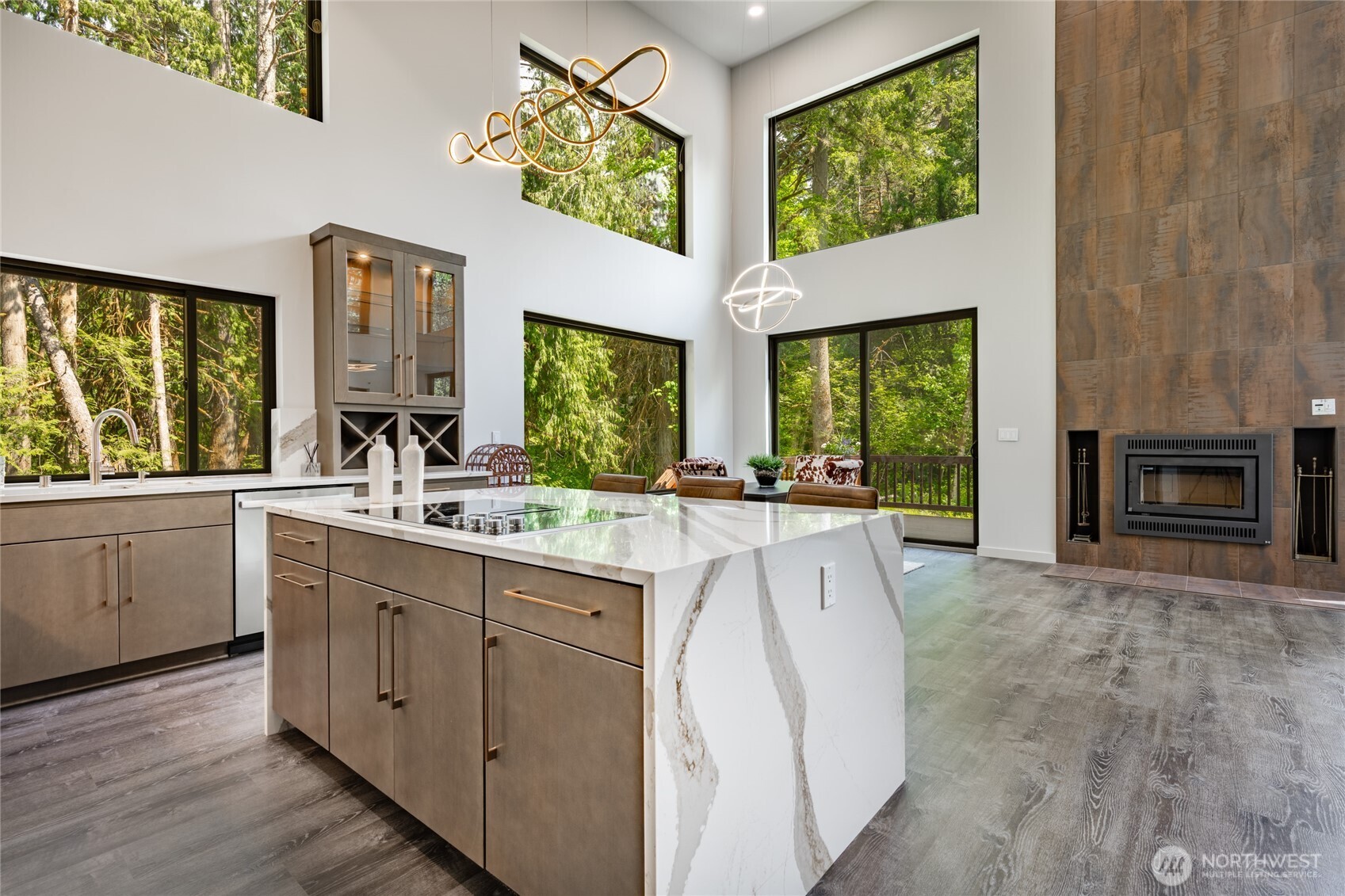 12031 Shuksan Rim Drive Deming, WA 98244 - Photo 9 of 39 a large white kitchen with a window wooden floor and stainless steel appliances